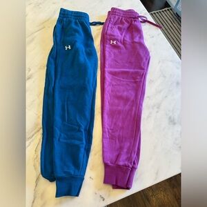 Two under armour sweatpants size XS. Blue and purple. Good condition.